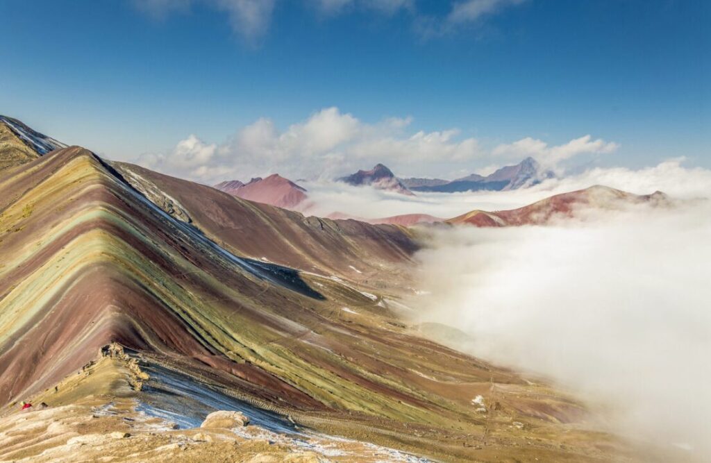 A picture of Vinicunca still covered by the common fog that forms during the early morning