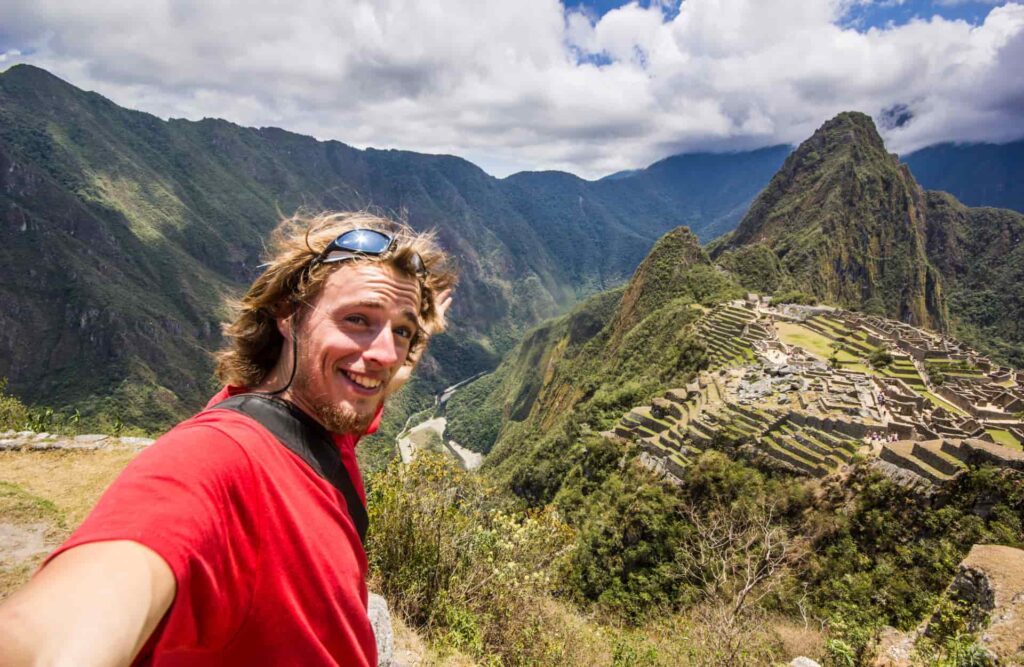 A happy Machu Picchu's visitor about to enter in the park itself.