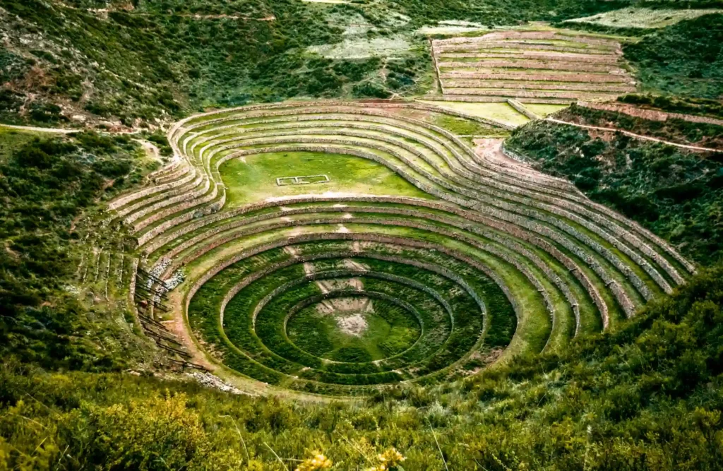 Moray's circular terraces turn green and leafy during the raining season in Cusco.