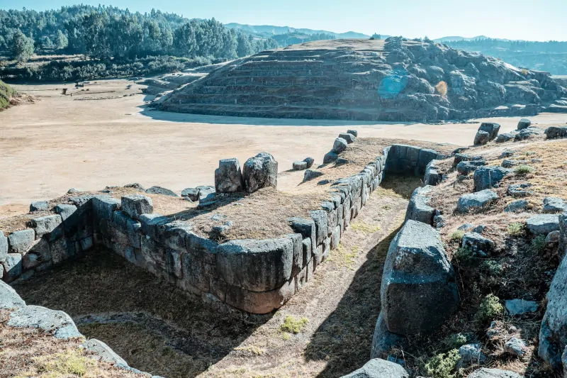 Why did the Incas build using stone instead of wood?