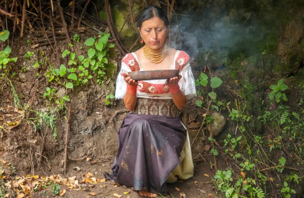 A native Ecuatorian woman realizes a ritual.